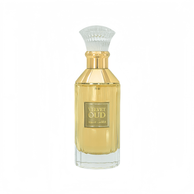 Lattafa Velvet oud unisex fragrance in a glass yellow liquid filled crystal clear elegant gold caped